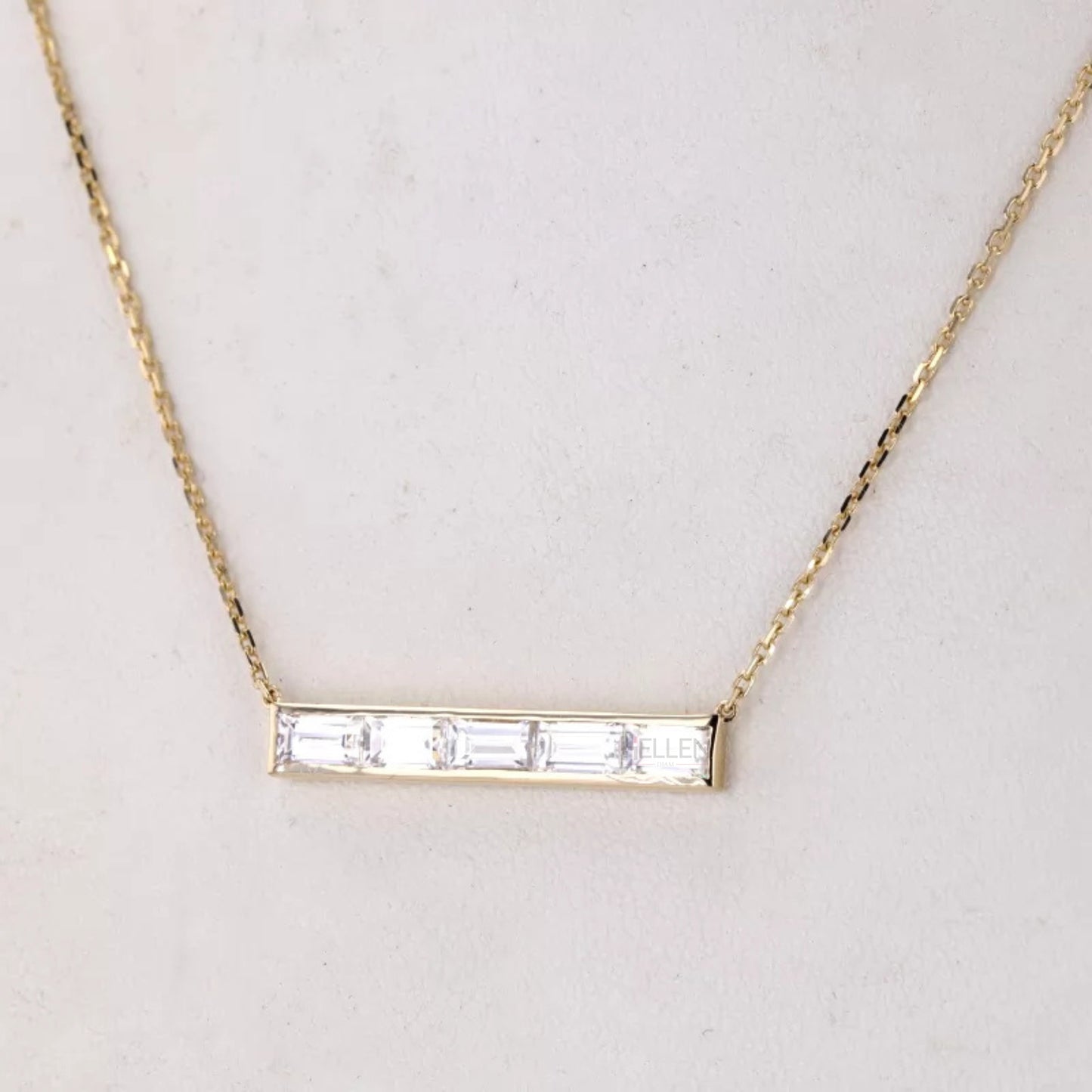 Five emerald cut stones in horizontal channel setting necklace – modern elegance with clean linear brilliance