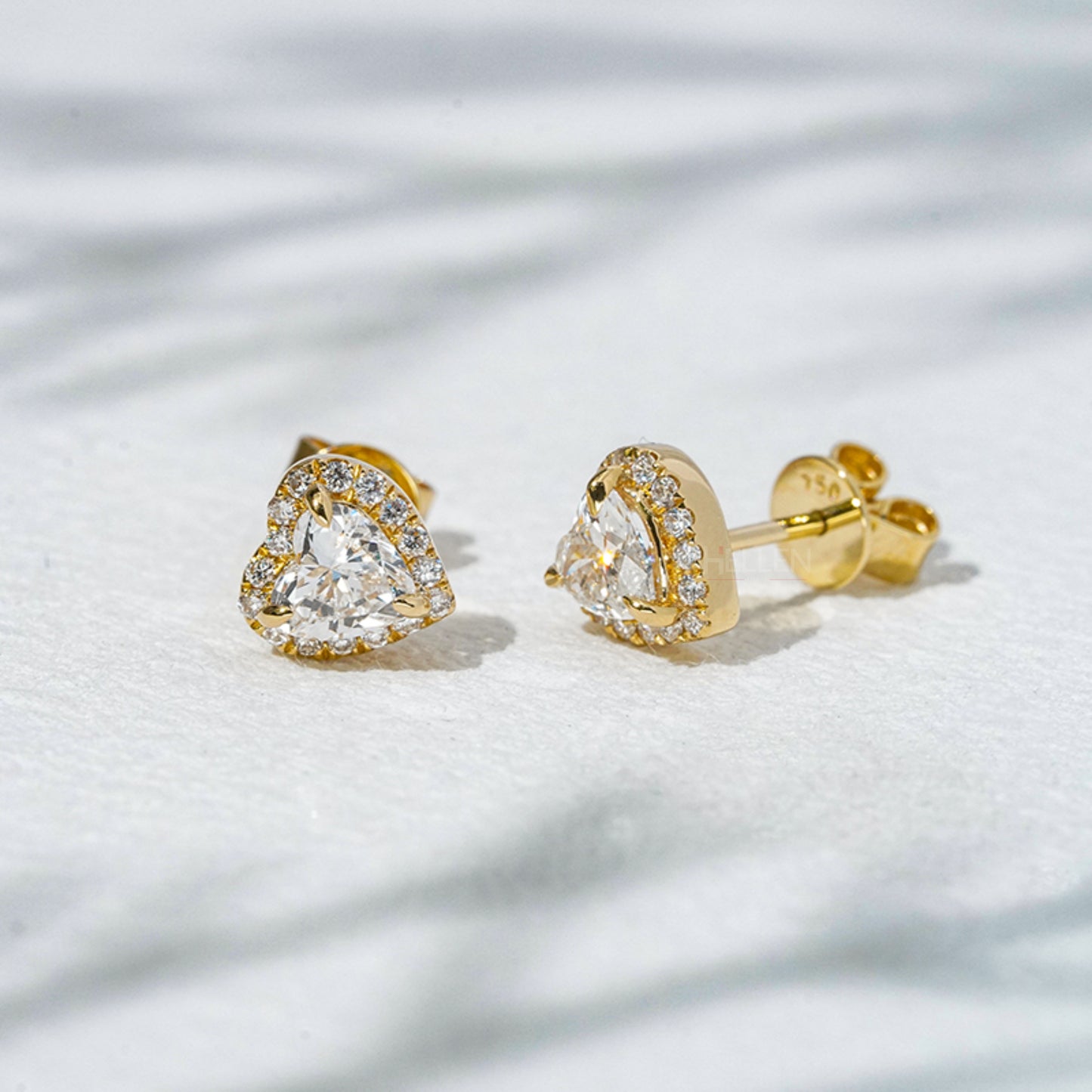 Heart shaped moissanite stud earrings in 925 sterling silver setting