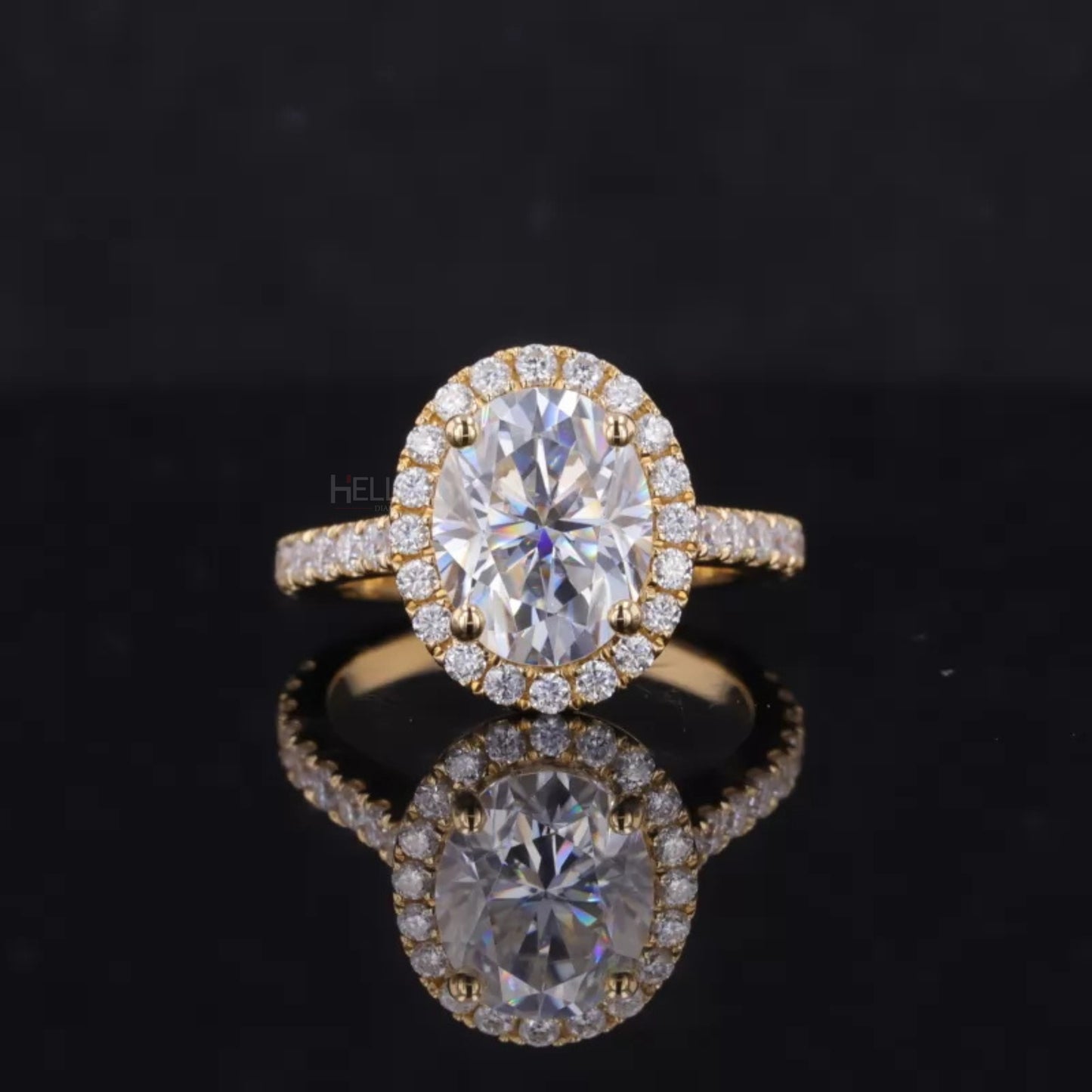 Three-stone proposal ring with oval cut moissanite center and round halo accents – brilliant and romantic style