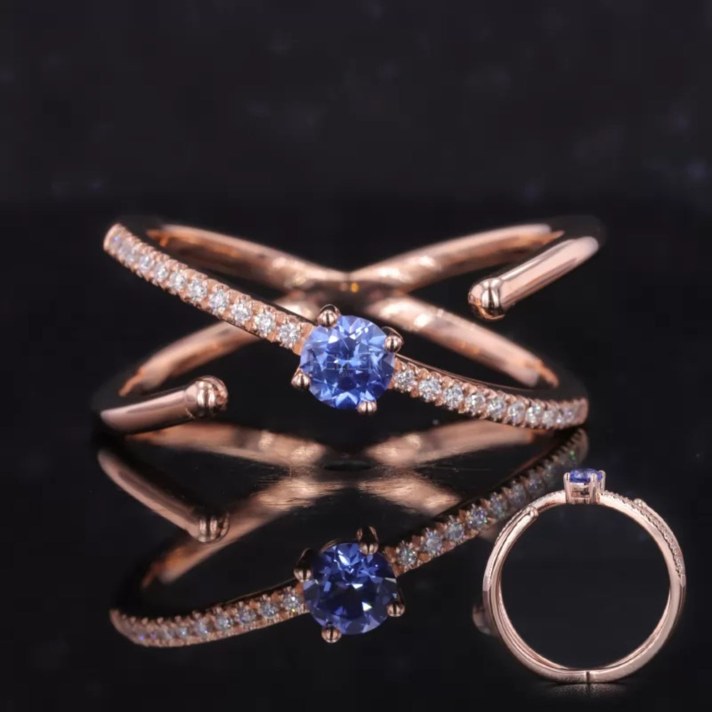 Blue sapphire crossover ring with round side stones – elegant twist design with bold center gemstone