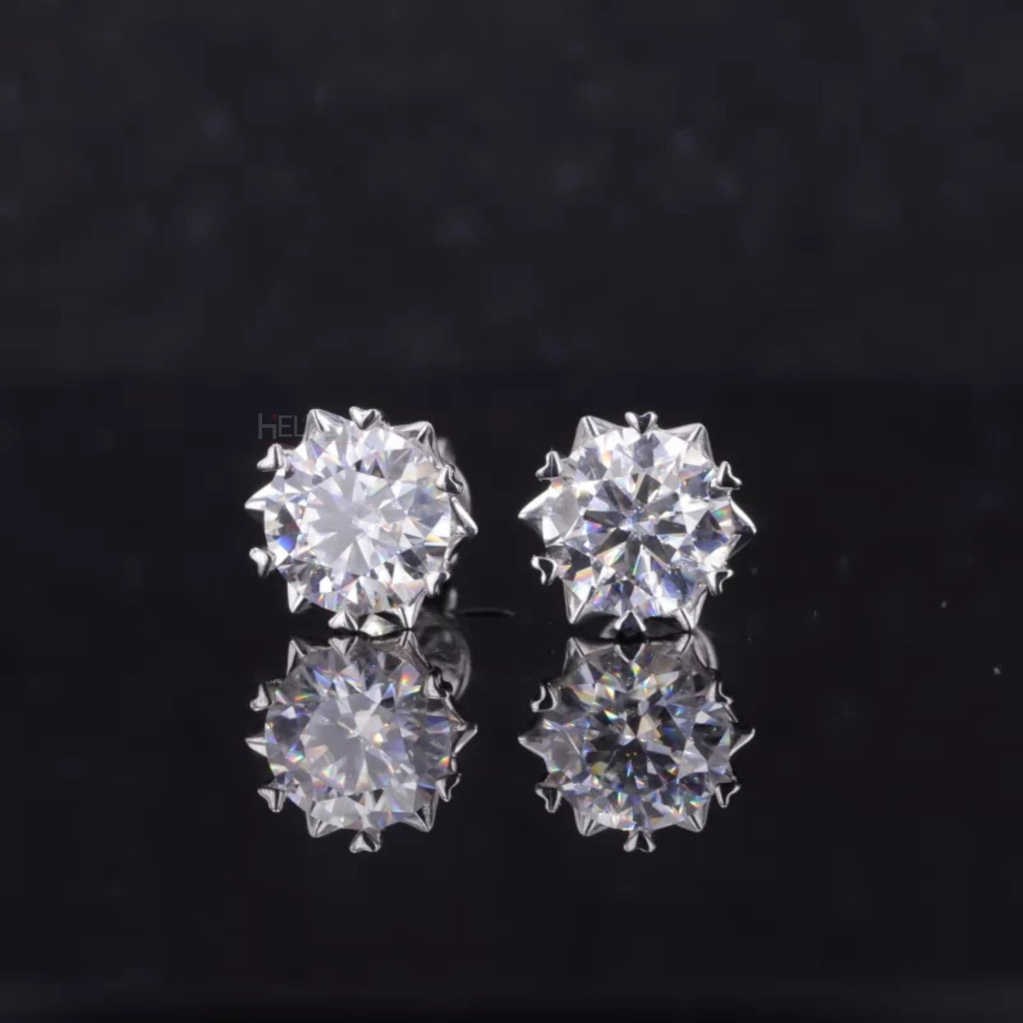Round cut moissanite studs with heart-shaped prongs – romantic detail in modern minimalist studs