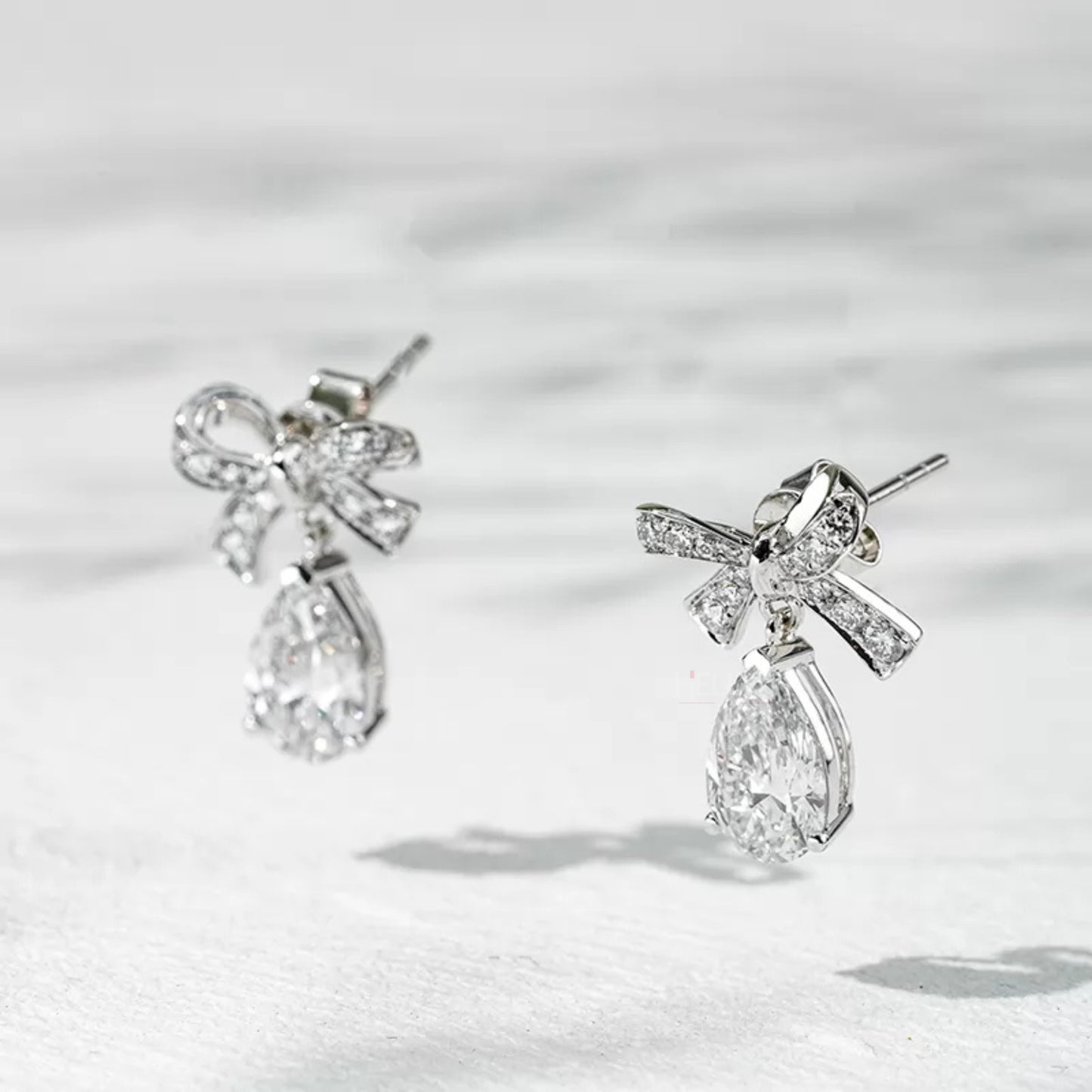 Pear Cut Moissanite Drop Earrings Elegant Bow Knot in Sterling Silver