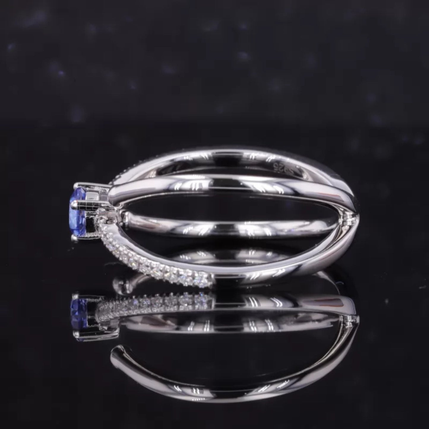 Blue Sapphire Round Cut Gemstone & Round Side Stone Crossover Ring