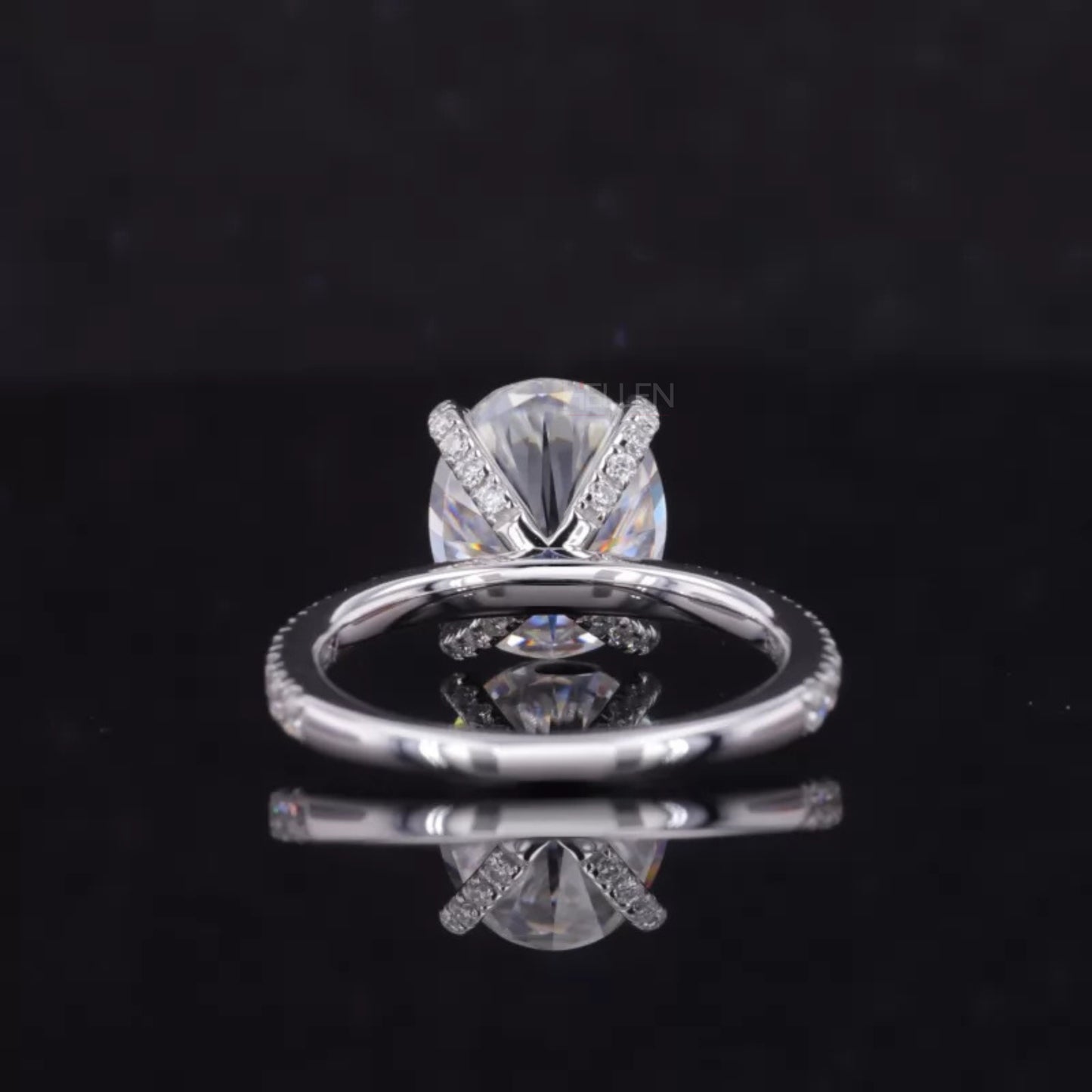 Oval Cut Moissanite Solitaire with Diamonds on Tiger Prongs Ring