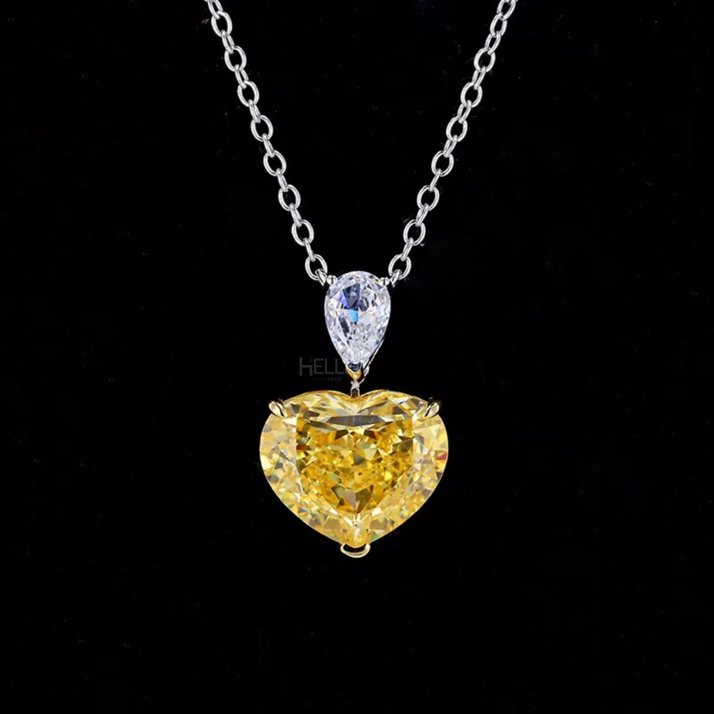 Two-tone necklace with pear moissanite and heart cut yellow sapphire – romantic contrast in a modern drop

