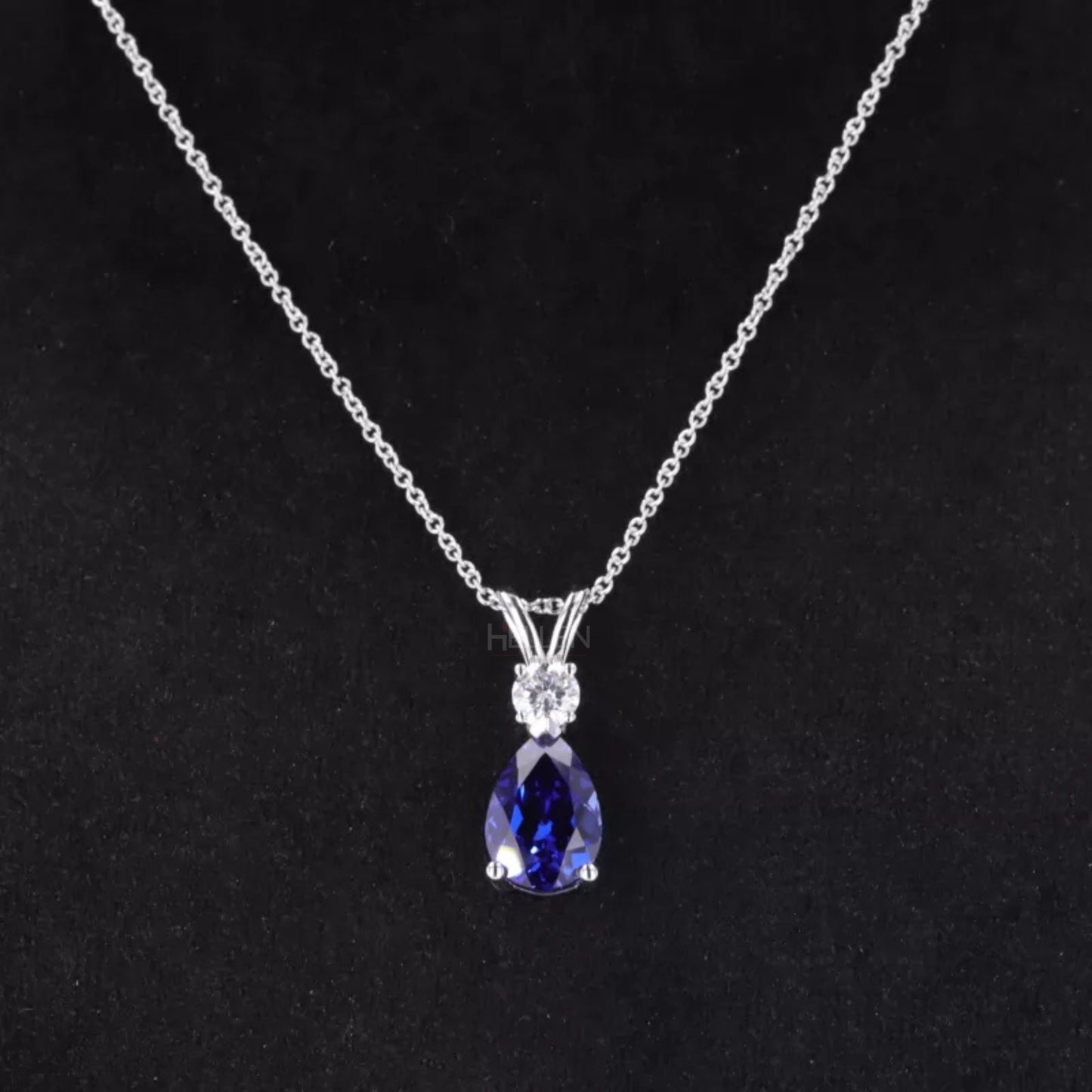 Elegant drop necklace with pear cut blue tanzanite and round moissanite – vibrant gemstone jewelry for special occasions

