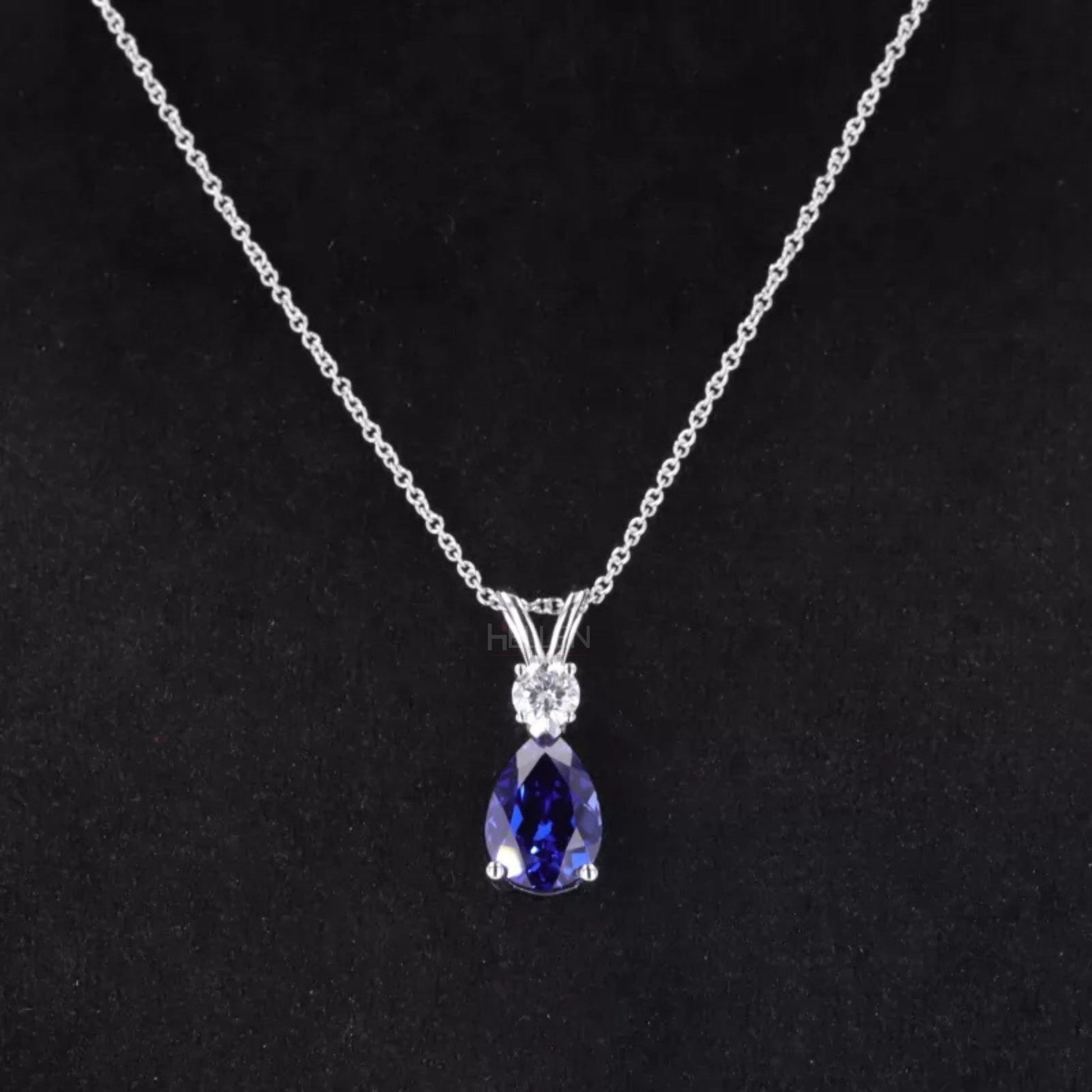 Elegant drop necklace with pear cut blue tanzanite and round moissanite – vibrant gemstone jewelry for special occasions

