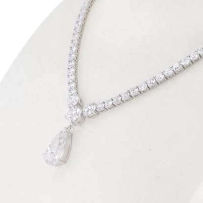 Bridal necklace with pear and round cut solitaire moissanite – graceful and sparkling pendant for weddings or formal wear


