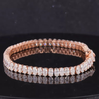 Classic tennis bracelet featuring oval cut moissanite in 4 prong setting – timeless and sparkling accessory