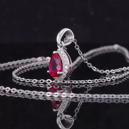 Pink Pear Cut Red Ruby Halo Necklace With Colorless Moissanite