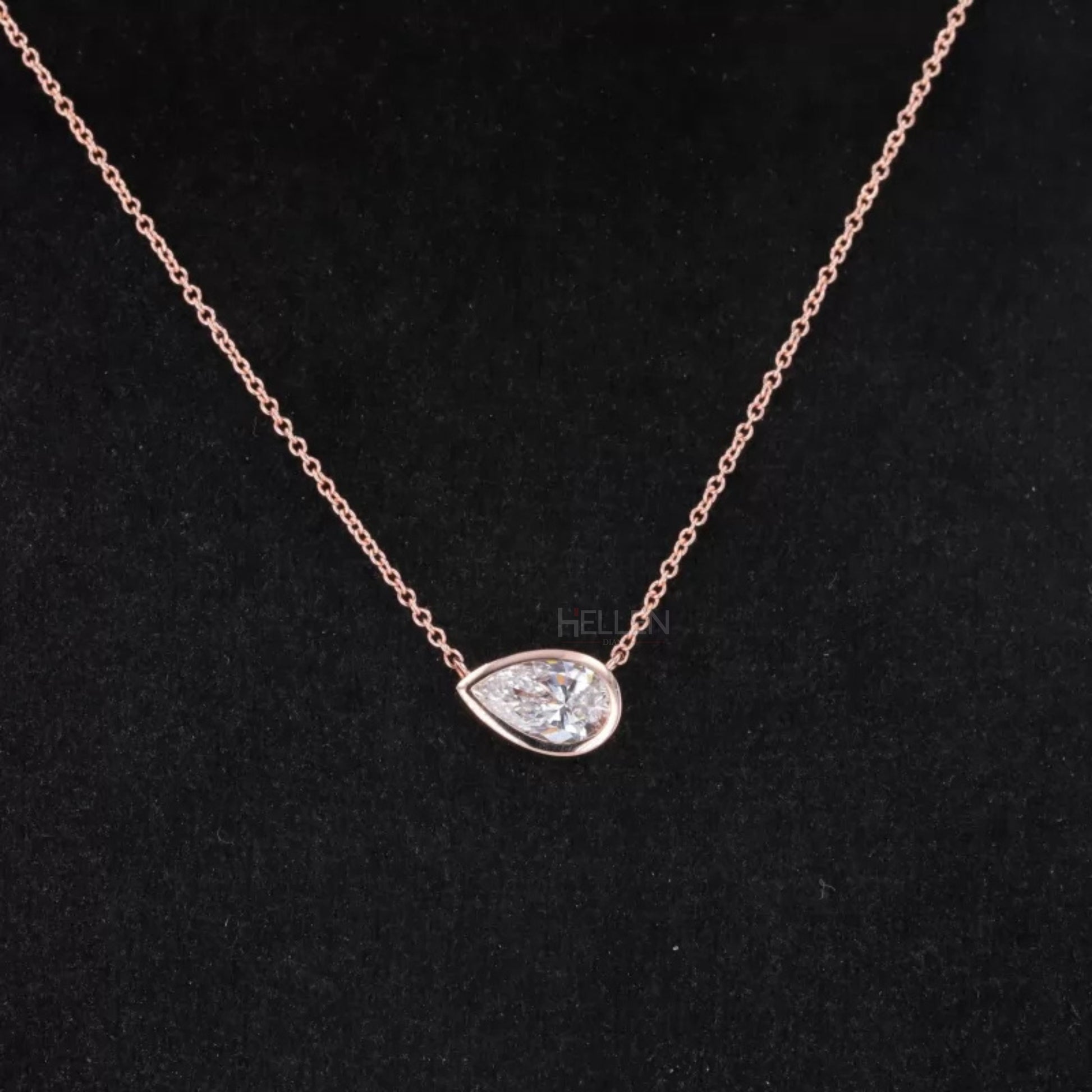 East to west pear cut moissanite solitaire necklace in bezel setting – modern twist on classic drop pendant