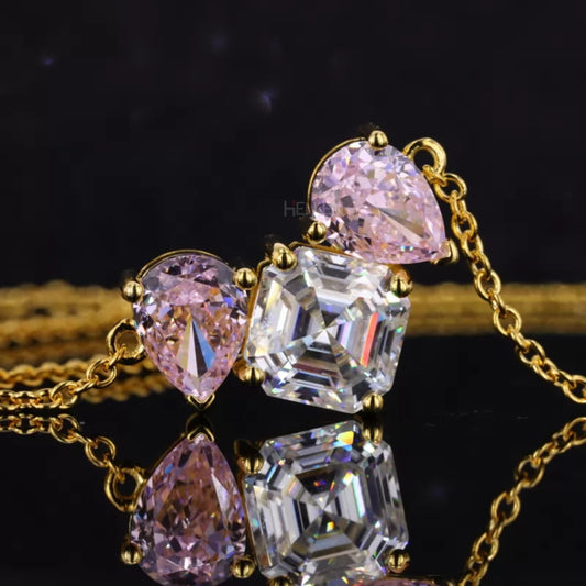 Three-stone necklace with Asscher moissanite and pear cut pink gemstone – luxury fusion of sparkle and color