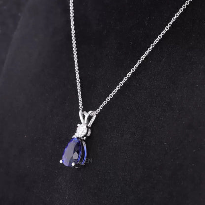 Pear Cut Blue Tanzanite Drop Necklace With Round Moissanite