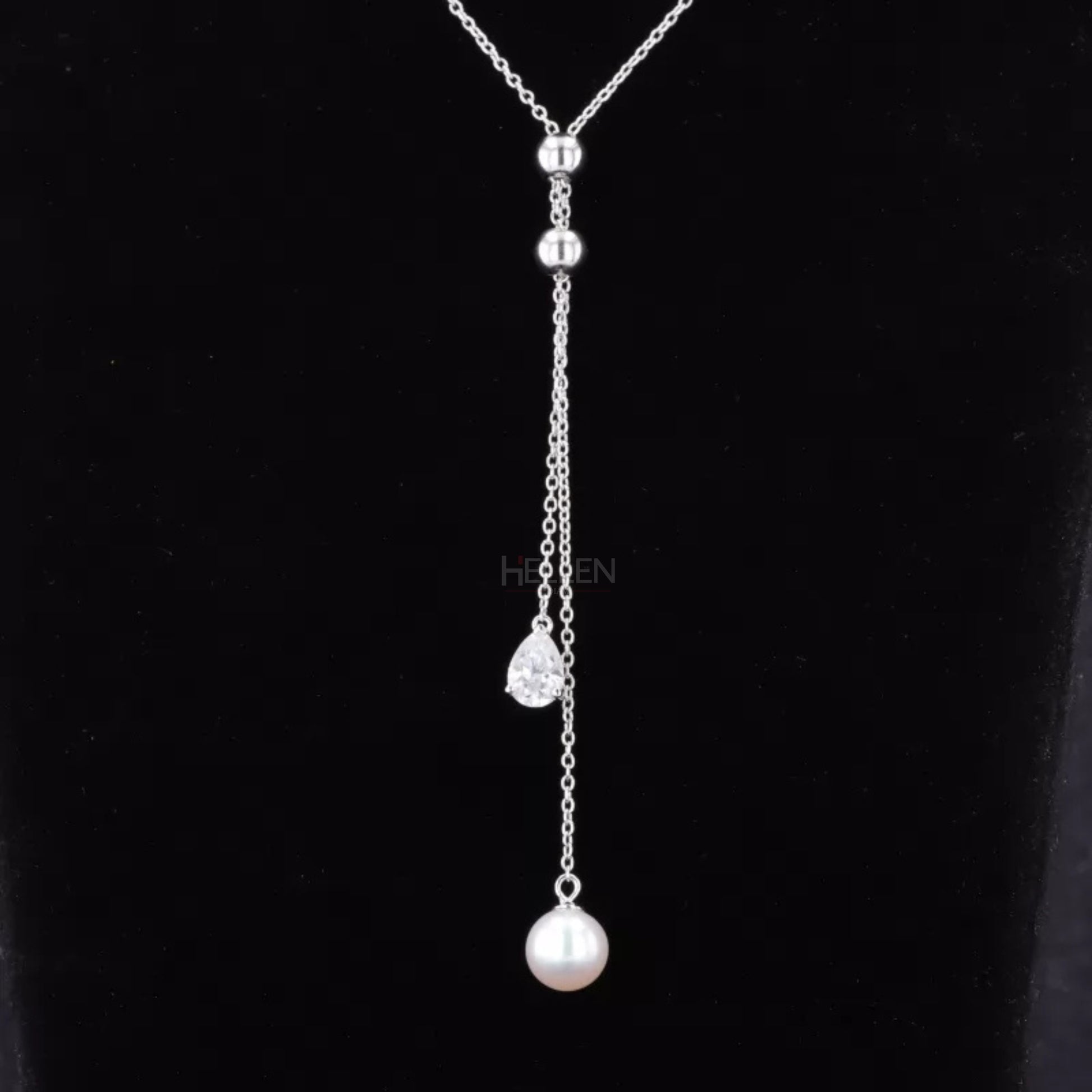 Adjustable necklace with pear cut moissanite and pearl – graceful blend of classic and contemporary style

