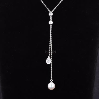 Adjustable necklace with pear cut moissanite and pearl – graceful blend of classic and contemporary style

