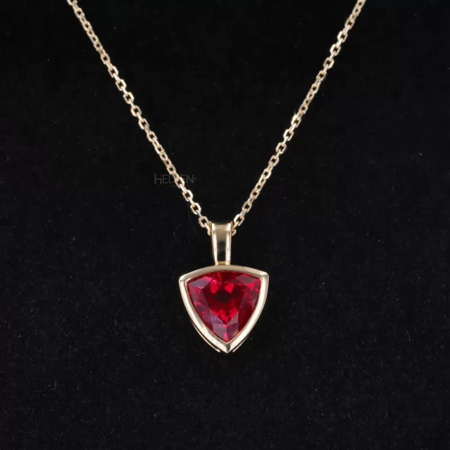 Trillion cut blood red ruby solitaire necklace – bold and luxurious gemstone pendant for gifting or special occasions