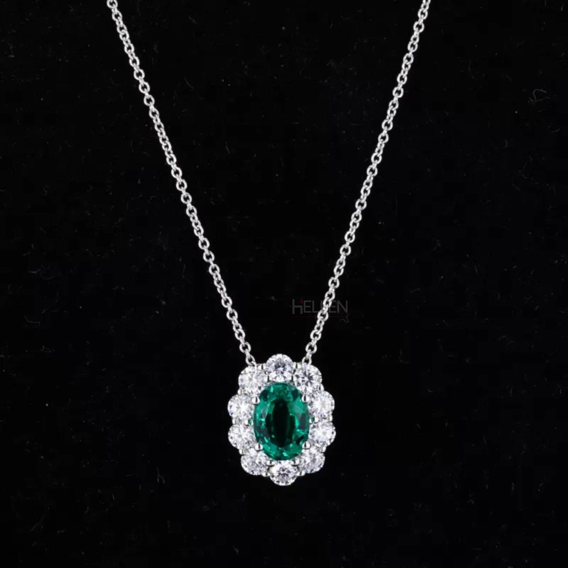 Oval emerald necklace with round moissanite halo – iconic elegance with vivid green center

