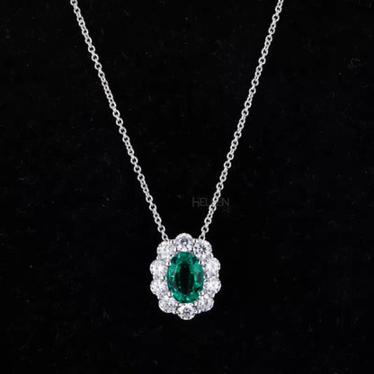 Oval emerald necklace with round moissanite halo – iconic elegance with vivid green center

