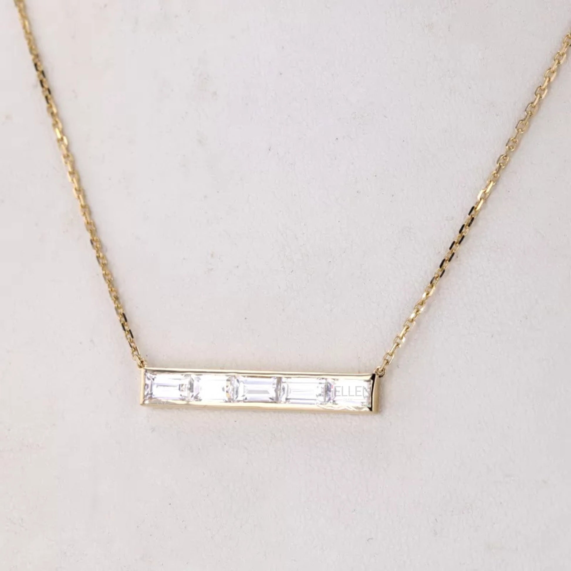 Five emerald cut stones in horizontal channel setting necklace – modern elegance with clean linear brilliance

