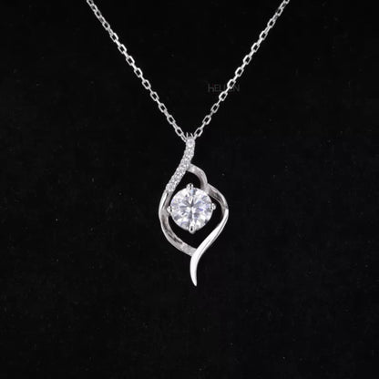 Leaf-inspired pendant necklace with round cut moissanite solitaire – nature-themed design for elegant wear
