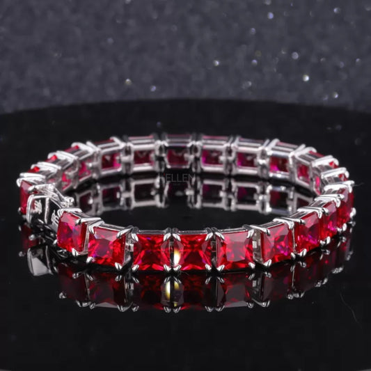 Tennis bracelet with asscher cut red ruby gemstones in claw prong setting – bold and luxurious statement piece

