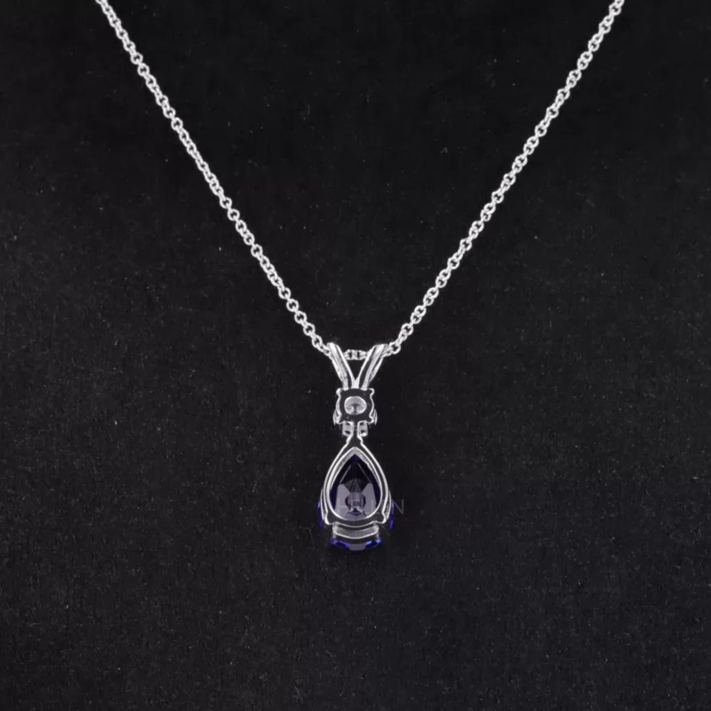 Pear Cut Blue Tanzanite Drop Necklace With Round Moissanite