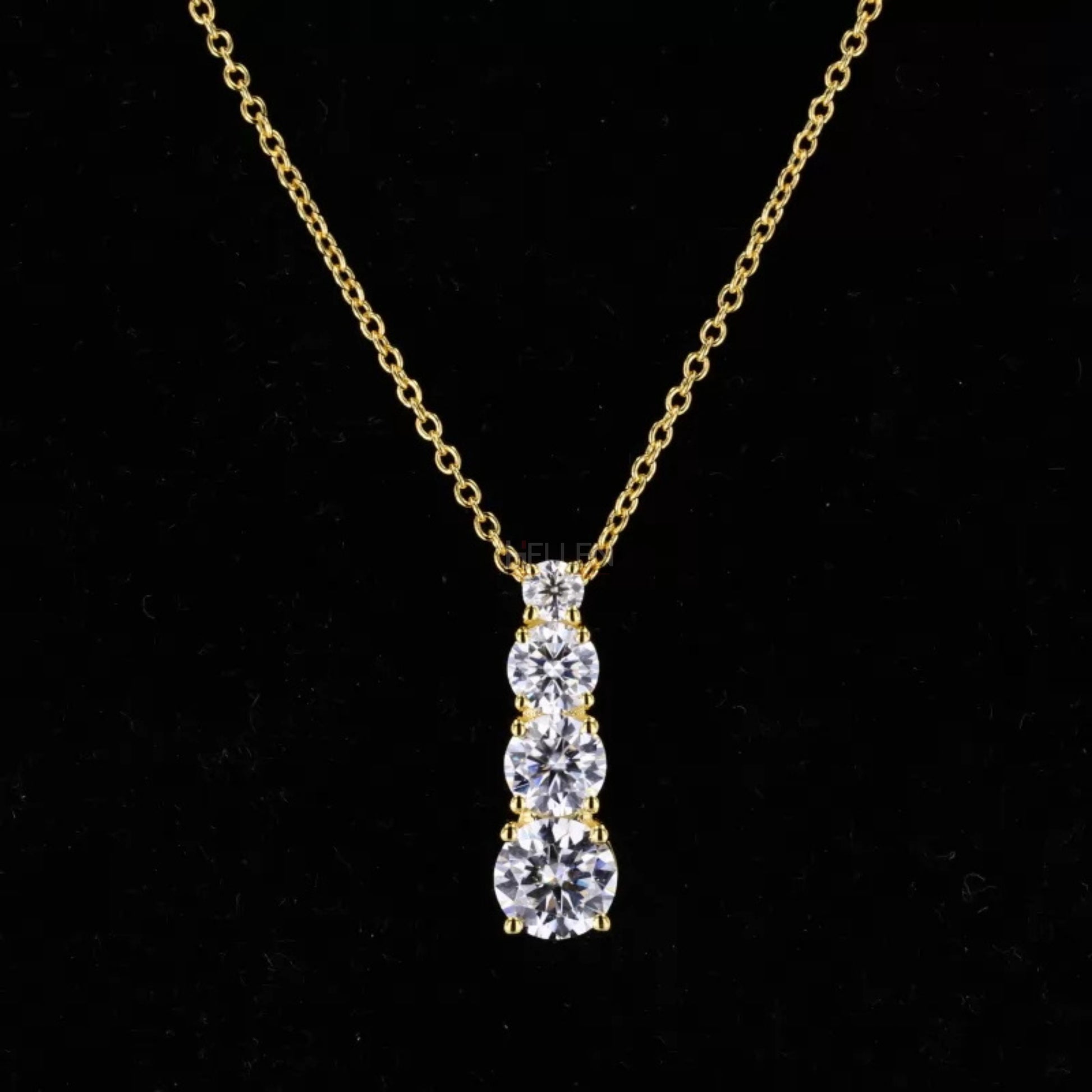 Long pendant necklace with small round cut moissanite in ascending line – elegant and minimalist vertical design