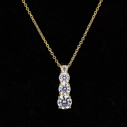 Long pendant necklace with small round cut moissanite in ascending line – elegant and minimalist vertical design