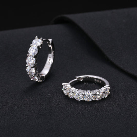 Huggie hoop earrings featuring round cut moissanite – sleek and secure style with radiant shine

