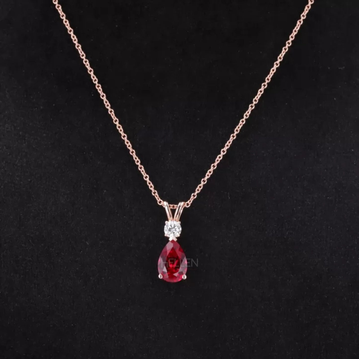 Dazzling red ruby drop necklace with pear cut center and round moissanite accents – bold and elegant design