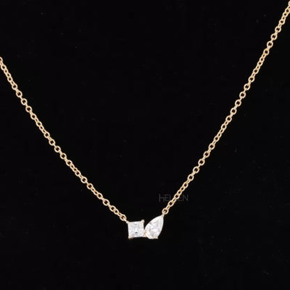 Toi et Moi necklace with princess and pear cut moissanite – symbolic “you & me” dual-stone design

