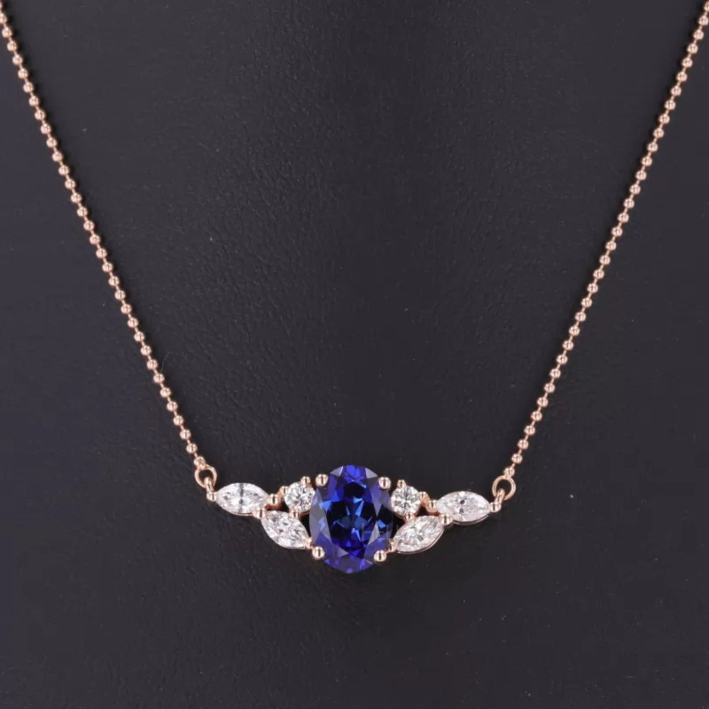 Blue tanzanite necklace with round and marquise moissanite – elegant mixed-cut design with vivid gemstone charm

