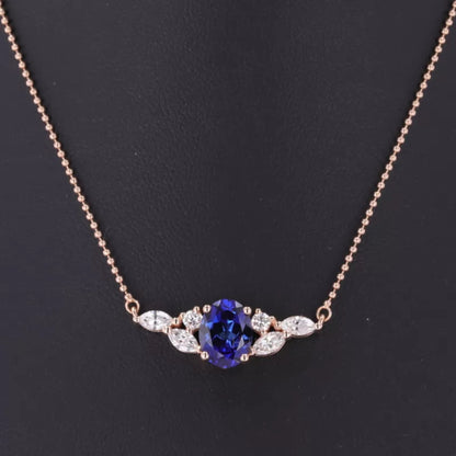 Blue tanzanite necklace with round and marquise moissanite – elegant mixed-cut design with vivid gemstone charm

