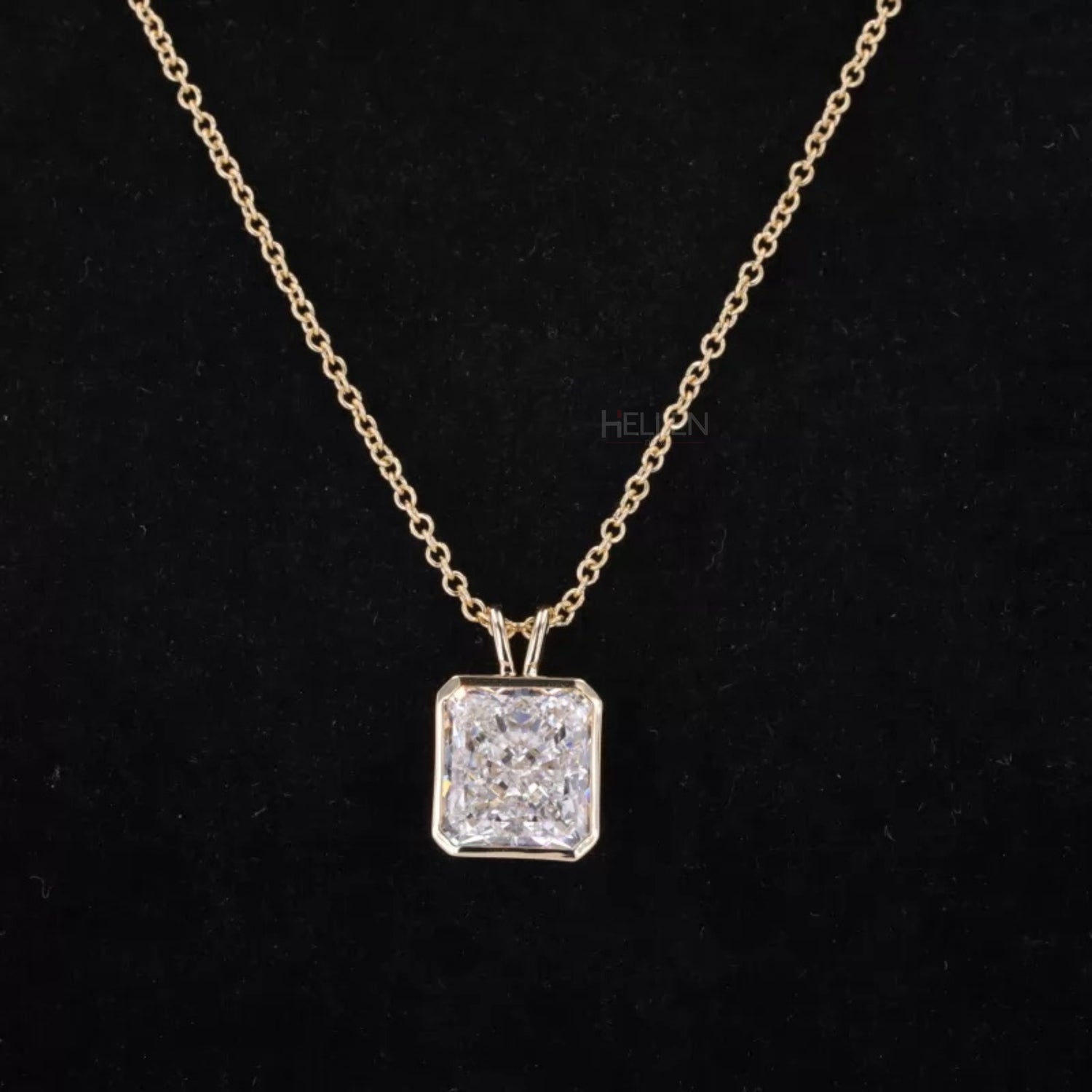 Radiant cut moissanite solitaire necklace in bezel setting with hoop design – sleek and luxurious pendant

