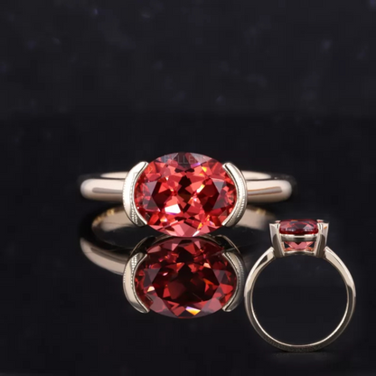 East-west set oval garnet solitaire engagement ring – rich red gemstone in a modern horizontal setting