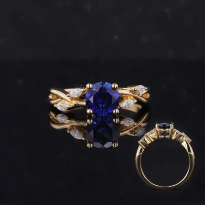 Round cut blue sapphire ring with marquise side stones – colorful gemstone engagement or statement ring