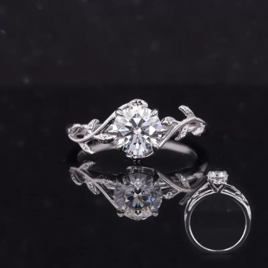 Nature-inspired engagement ring with round cut moissanite and twisted leaf branch design – symbolic and elegant piece
