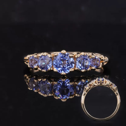 Purple sapphire five-stone anniversary ring – vibrant gemstone band for colorful celebration