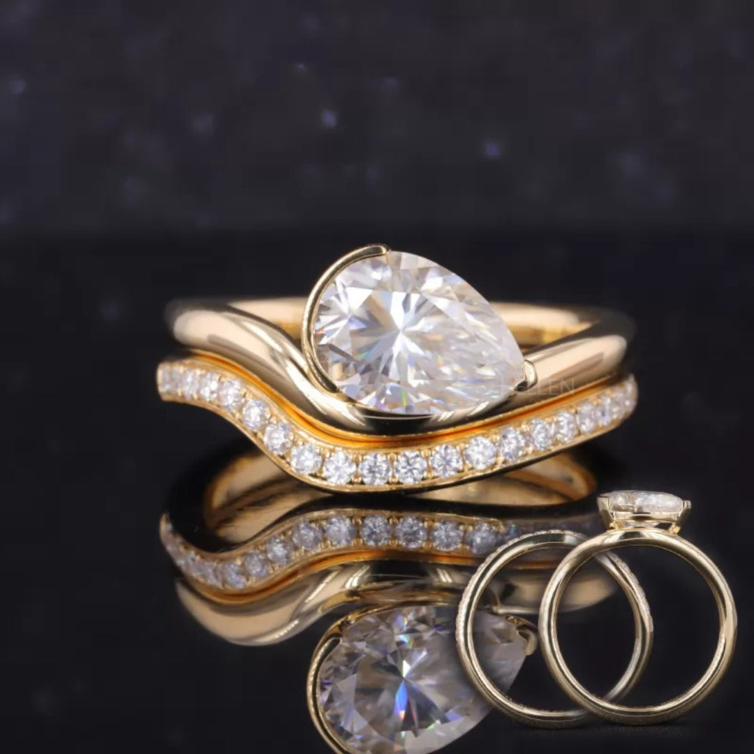 Stackable bridal ring set with pear solitaire and round cut moissanite – versatile elegance for special moments