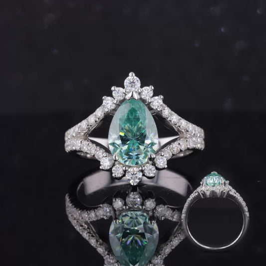 Split shank engagement ring with blue-green pear and round cut moissanite – unique and colorful proposal ring


