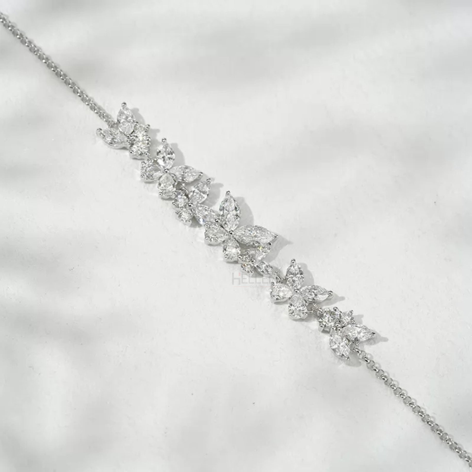 Butterfly-inspired bracelet with pear and marquise cut moissanite stones – delicate and feminine chain design