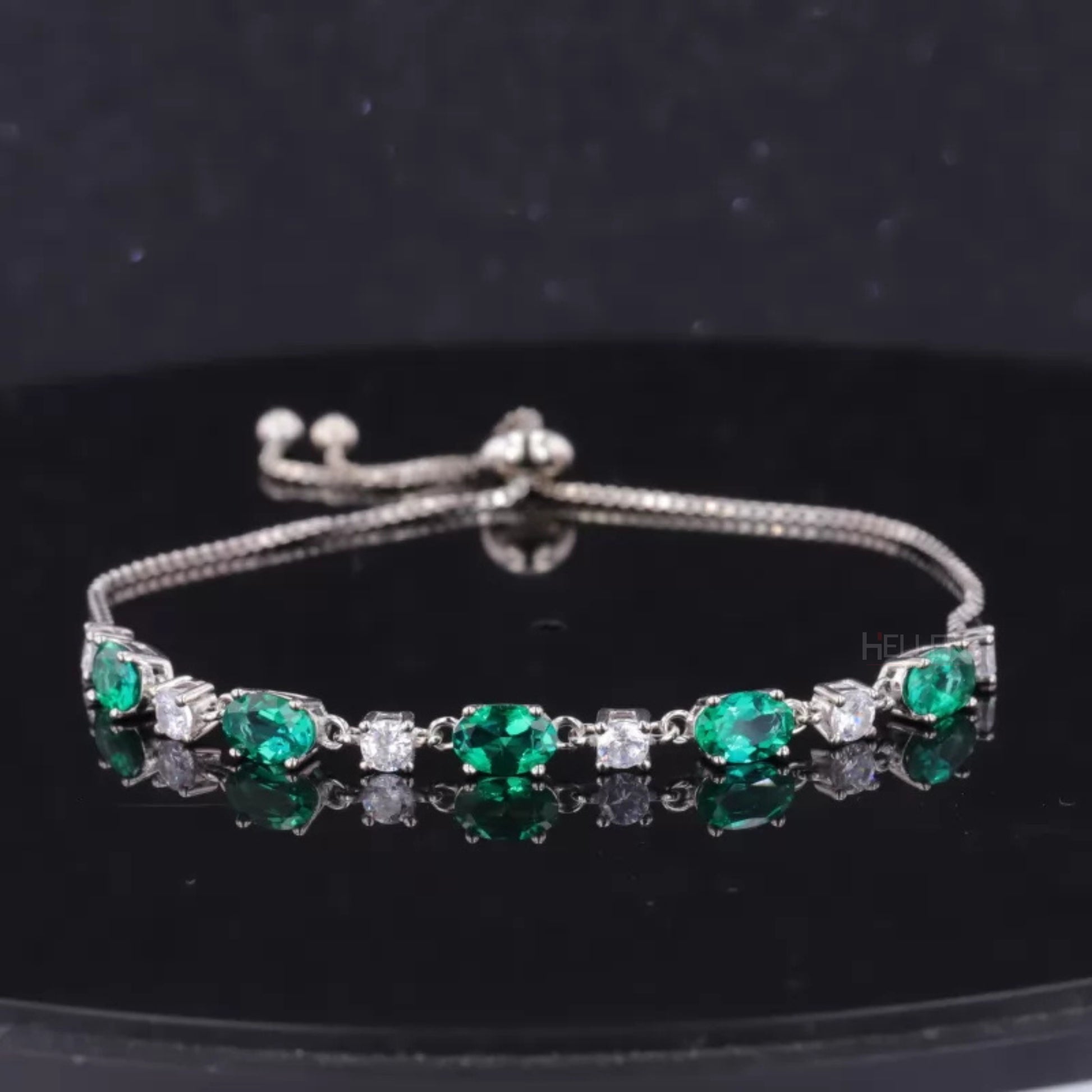 Elegant loose bracelet with green oval gemstone and round moissanite accents – colorful fine jewelry for her