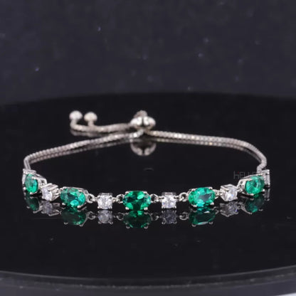 Elegant loose bracelet with green oval gemstone and round moissanite accents – colorful fine jewelry for her