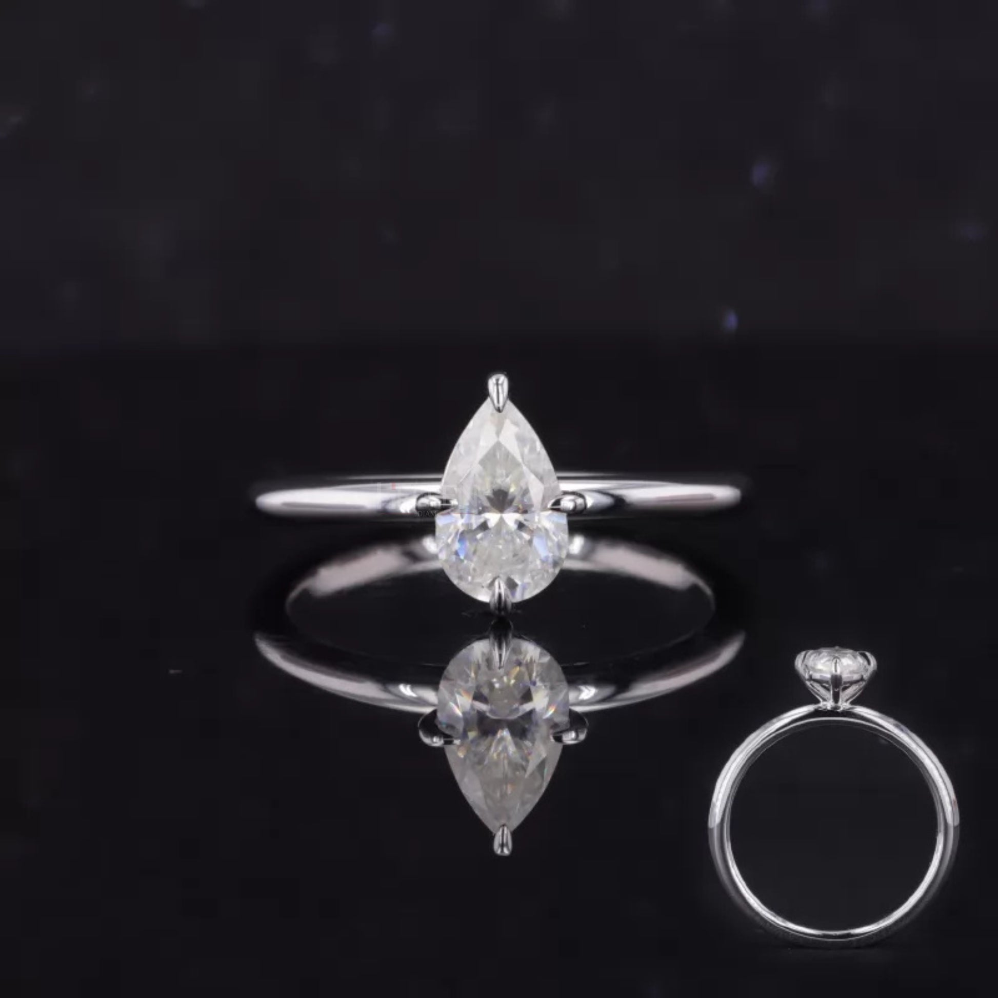 Pear cut moissanite solitaire ring with bold tiger prong setting – statement engagement ring with modern elegance