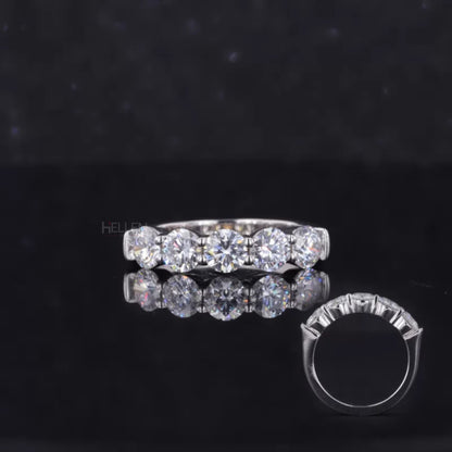 Five round cut moissanite stones in a wedding band – radiant and classic bridal design