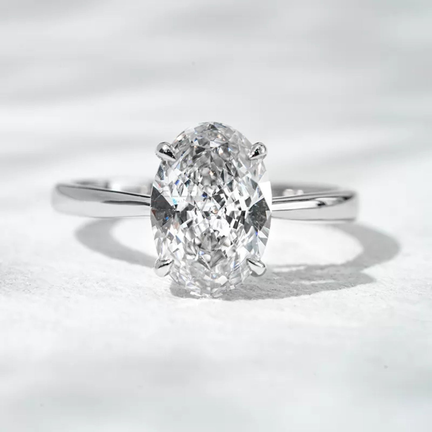 Solitaire oval cut engagement ring with secure claw prong setting

