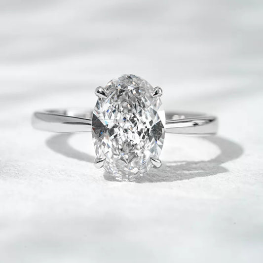 Solitaire oval cut engagement ring with secure claw prong setting

