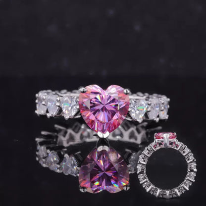 Heart cut pink sapphire solitaire ring with moissanite heart-shaped shank – romantic and symbolic engagement piece

