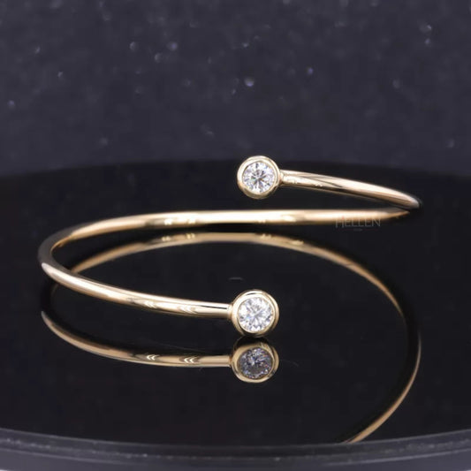 Contemporary open gap bracelet with flexible fit and round cut solitaire moissanite – sleek and elegant design