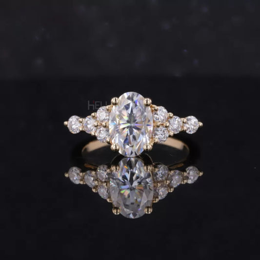 Vintage-inspired cluster ring with oval moissanite solitaire and round accents – timeless engagement piece

